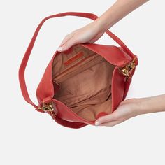 This bag pairs style and function effortlessly, converting from a shoulder bag to crossbody for two looks in one. Pier Shoulder Bag In Pebbled Leather  Red Clay SHOULDER in Red Clay | Hobo® Versatile Crossbody Hobo Bag With Leather Lining, Versatile Leather Lined Hobo Crossbody Bag, Versatile Leather-lined Crossbody Hobo Bag, Versatile Red Shoulder Bag For On-the-go, Red Leather Bucket Bag For On-the-go, Everyday Leather Crossbody Hobo Bag, Everyday Crossbody Hobo Bag With Gold-tone Hardware, Leather Bags With Gold-tone Hardware For Daily Use, Versatile Red Satchel For Everyday Use