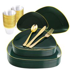 a set of green and gold dinnerware with forks, spoons and cups on it