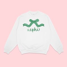 Unleash your inner girly girl with our Coquette Crewneck. This adorable crewneck is perfect for any preppy fashionista looking to show off her sorority pride. Stay cozy and chic with our girly and fashionable design. 🎀 PRODUCT DESCRIPTION 8 oz. 50/50 cotton/polyester Unisex fit This item is MADE TO ORDER and is FINAL SALE. Production time takes approximately 4-12 BUSINESS DAYS Please visit our Shop Policies and FAQ for more information. FOR CUSTOM ORDER WE REQUIRE A MINIMUM OF 24+ PIECES CONTACT US FOR WHOLESALE OR GROUP ORDERS Follow Us: Instagram @duostudiodesigns www.duostudiodesigns.com We are officially licensed for:  Alpha Chi Omega Alpha Delta Pi Alpha Epsilon Phi Alpha Gamma Delta Alpha Omicron Pi Alpha Phi Alpha Sigma Alpha Alpha Sigma Tau Alpha Xi Delta Chi Omega Delta Delta Del Coquette Crewneck, Alpha Alpha, Omega Alpha, Alpha Epsilon Phi, Delta Chi, Theta Phi Alpha, Alpha Omicron Pi, Alpha Sigma, Sigma Alpha