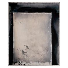 an abstract painting with black and white paint on the bottom, in a square frame