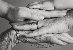 an older woman holding the hand of a younger person's hand with her fingers