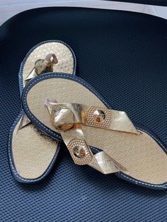 Description : Add a touch of dazzling elegance to your ceremonies with our Ghanaian slippers in golden yellow, designed for precious moments like weddings, christenings and other celebrations. Handmade by talented artisans in Ghana, these slippers combine beauty and comfort to make your feet shine at your special events. Features : Vibrant Golden Yellow Color: A vibrant and refined golden yellow that catches the light and draws the eye. Ceremonial Design: Perfect for adding a sophisticated touch Gold Round Toe Wedding Shoes For Summer, Elegant Formal Flat Slippers, Elegant Gold Wedding Shoes For Summer, Gold Flat Wedding Shoes For Party, Gold Closed Toe Sandals For Formal Occasions, Elegant Party Slippers With Round Toe, Elegant Round Toe Party Slippers, Gold Toe Post Sandals For Party, Designer Gold Open Toe Sandals