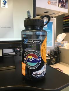 a water bottle sitting on top of a desk