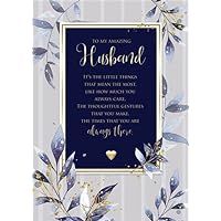 a blue and white wedding card with leaves on the front, in gold foil lettering