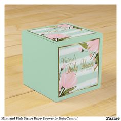 a baby shower box with pink flowers on the front and green stripes in the back