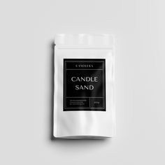 a bag of candle sand sitting on top of a white table