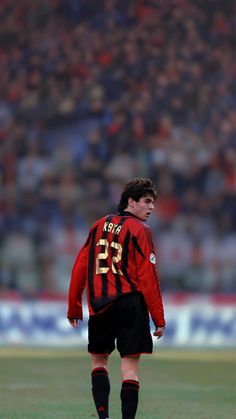 a soccer player is standing on the field