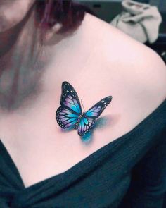 a woman with a butterfly tattoo on her chest