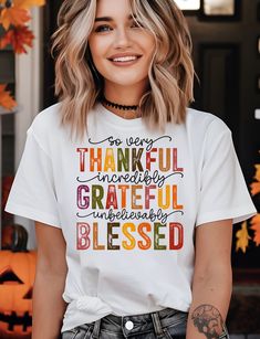 Celebrate the season of gratitude with our 'So Very Thankful, Incredibly Grateful, Unbelievably Blessed' tee! This heartwarming design is a sweet reminder of life's many blessings, perfect for those who love to embrace thankfulness with style and grace. Wear it and share your gratitude with the world! About: The unisex soft-style t-shirt puts a new spin on casual comfort. Made from very soft materials, this tee is 100% cotton for solid colors. Heather colors and sports grey include polyester. Th Comfortable Slogan T-shirt For Fall, Casual Fall T-shirt With Text Print, Fall Slogan T-shirt With Relaxed Fit, Fall Graphic T-shirt With Slogan, Fall Relaxed Fit T-shirt With Text Print, Inspirational Tees, Fall Tee, Style And Grace, Twill Tape