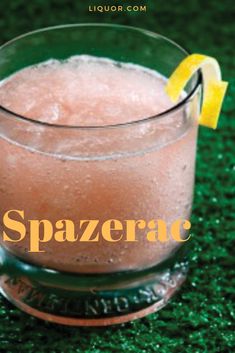 a close up of a drink in a glass on a table with the words spazerac above it