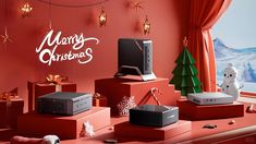 an assortment of electronic devices on display in front of a christmas tree and snow scene