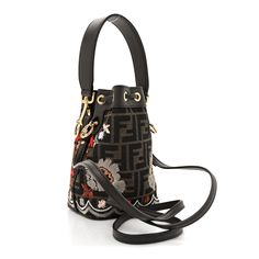 This is an authentic FENDI Fabric Jacquard FF Floral Embroidered Quilted Mini Mon Tresor Bucket Bag in Ebano Multicolor. This chic shoulder bag is crafted Fendi FF monogram in brown with pink, red, white and light brown flower & boarder embroidery. The bag features a leather shoulder strap, polished gold hardware and a leather top handle. Ff Monogram, Brown Flower, Leather Top, Pink Red, Gold Hardware, Top Handle, Light Brown, Bucket Bag, Red White