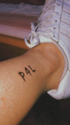 a person's foot with the word pal written on it, in black ink