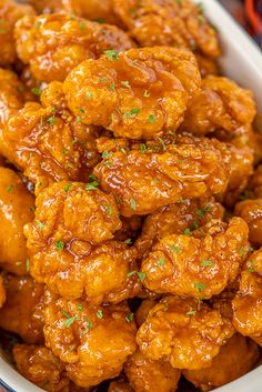 sweet and spicy boneless wings in a white bowl with the words, sweet and spicy boneless wings