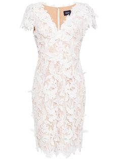 a white lace dress with ruffles on the shoulders and neckline is shown