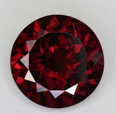 a red diamond is shown on a white surface