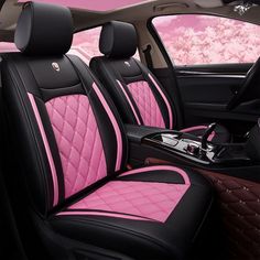 the interior of a car with pink and black cloths on it's seats