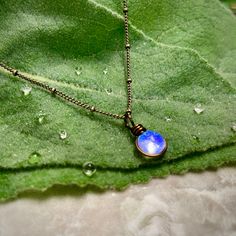 "The Morning Dew Drop Necklace is inspired by the beauty of nature. It has the perfect Summer Aesthetic that goes with everything. It is one of the smallest pendants that I make. The glass used is Crystal Clear with a dichroic glass with a delicate iridescence that changes in color. The sparkle is subtle and simple and changes depending on the lighting and the colors behind the glass. This is a great size for everyday wear or to layer with other designs. Chains: Cable Chain and Satellite Chain. Jewelry Summer Aesthetic, Perfect Summer Aesthetic, Fairycore Jewelry, Earthy Necklace, Aesthetic Necklace, Wanderlust Jewelry, Jewelry Summer, Morning Dew, Jewelry Minimalist