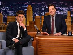 two men sitting in chairs on the tonight show