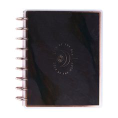 a black notebook with the moon and stars on it