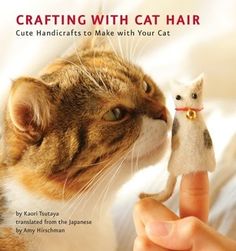 a book about crafting with cat hair is being held by someone's hand