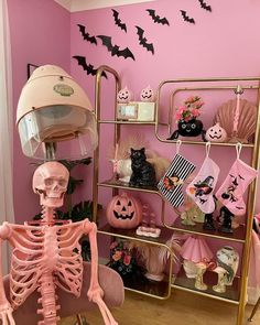 there is a skeleton in the room with pink walls