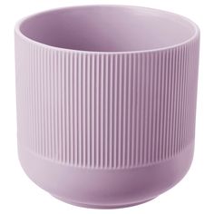 a purple vase sitting on top of a white table