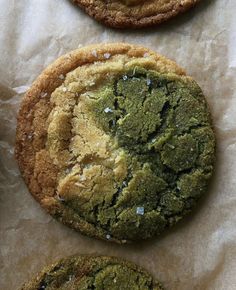 three cookies with green and white toppings on top