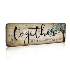 a wooden sign that says together is our favorite place to be with the tree on it