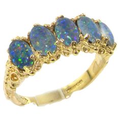 Five Colorful Sparkling Created Opal Triplets set within this delightful English Victorian style Gold setting. Each Opal Triplet measures approx 6x4mm (0.24"x0.16"), is securely claw set, and the setting has a nice solid feel with a substantial shank. Completely made from Solid English Yellow 10K Gold, tested and Hallmarked by the Assay Office which confirms the purity of the Gold. The Hallmark includes the .417 marking plus the unique mark of the Assay Office. These are Created Opal Triplets. T Engagement Ring Blue Stone, Diamond Eternity Rings, Rings Pandora, Rings Cheap, Rings Eternity, Rings White Gold, Gold Luxury, Eternity Rings, Full Eternity Ring