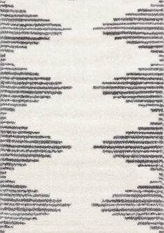 an area rug with black and white designs on it