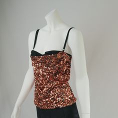 90s Vintage Dolce and Gabbana Bronze  sequin corset top featuring exposed bra detail, black adjustable straps, and center back zipper closure.  exquisite, would keep if this fit me  Size: 40 UK10  Pictured on size 6 UK pinned  Very Good Vintage Condition, minor wear to be expected of any secondhand item  Internal tags are loose and could do with a stitch to reinforce. The same item is currently on 1st dibs for 1500 USD Sequined Fitted Corset For Party, Fitted Party Corset With Spaghetti Straps, Sequined Corset For Party Season, Party Tops With Built-in Bra And Overbust Shape, Party Camisole Corset With Boned Bodice, Party Corset With Spaghetti Straps And Built-in Bra, Camisole Corset With Boned Bodice For Party, Fitted Party Tops With Corset Back, Glamorous Sequined Corset For Night Out