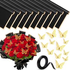 red roses and butterflies are in front of a black ribbon