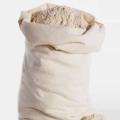 a bag filled with sand sitting on top of a white floor