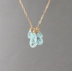 Five teardrop blue aquamarine stones hang on a 14k gold fill. 14k rose gold, or sterling silver chain. Largest stone measures about 1/2 of an inch in length. You can choose the length you want when you checkout. If you want a size smaller than 16 inches, let me know when you checkout. You can add an extension chain to your necklace by adding this item to your cart: https://www.etsy.com/listing/182425506/add-on-extension-chain-gold-fill-or Great piece to layer! Item comes packaged in a jewelry bo Birthstone Charm Necklace, Silver Bead Necklace, Stone Beaded Necklace, Gold Bead Necklace, Buy Necklace, Aquamarine Jewelry, Aquamarine Stone, Aquamarine Blue, Sterling Silver Chain