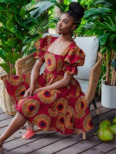 Boasting a stylish square neckline and a tiered skirt, the Batik Dress offers comfort and a flattering silhouette with a fun, twirl-ready design. * sash belt not included Approx. 38" Length (center back) based on size M 100% Cotton. Colours: Multi-print (green, navy, ivory, black) Cotton lined bodice Back zipper closure African Print Smocked Dress, Flowy African Dress, African Graduation Dress Style, African Summer Dress, Cute African Dresses, Vitenge Dresses Designs, African Style Dresses, Dresses African Fashion, Chitenge Dresses