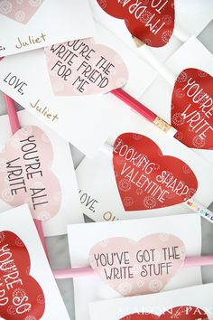 valentine's day cards with writing on them and envelopes in the shape of hearts