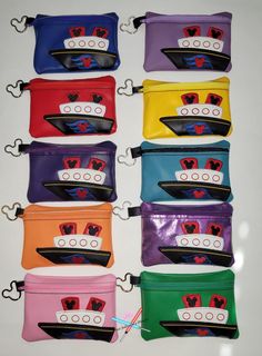 six different colored purses with spiderman faces on them