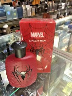 a spider man perfume bottle in a display case