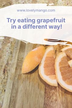 oranges on a cutting board with the words try eating grapefruit in a different way