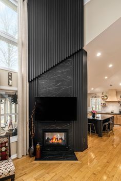 a living room filled with furniture and a fire place in the middle of a room