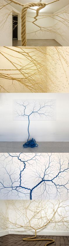 four different views of the same room in an art museum, each with blue and white paint