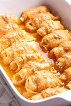 a casserole dish filled with food on top of a table