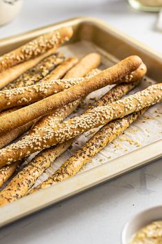 a tray with sourdough breadsticks Sourdough Discard Grissini, Uses For Sourdough Starter Discard, Sour Dough Bread Sticks, Quick Sourdough Discard Recipes Crackers, Sourdough Breadsticks Discard, Grissini Breadsticks Recipe, Sourdough Discard Breadsticks Recipe, Sourdough Bread Sticks Recipe