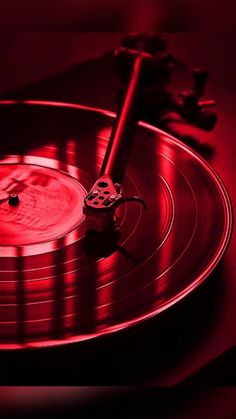 a turntable with a red light shining on it