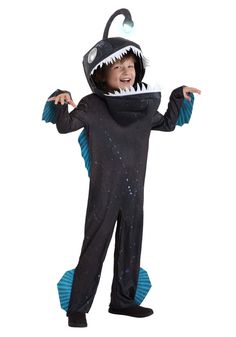 a child in a costume that looks like a shark