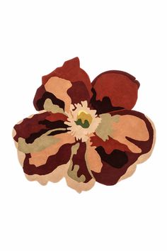 a flower is shown in the middle of a white background with brown and green colors