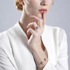 Surround her with flowers all year long. Buy that special someone this silver flower bangle, whether she is celebrating a holiday or if she is just a lover of flowers. Crafted in two tone sterling silver, the bangle consists from two blossoms on the two ends and a high polished bangle, which shows simple elegance. The cuff bangle is easy to adjust the size to fit for her wrist. Surprised her with this charming piece.Carat Weight: 3 ctStone Size: 6 mmNumber of Stones: 2 Stone Shape: RoundStone Co Jeulia Jewelry, Diamond Jewelry Set, Knot Stud Earrings, Knot Studs, Wedding Luxury, White Bracelets, Silver Jewellery Sets, Moissanite Jewelry, Bangle Set