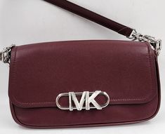 Michael Michael Kors Parker Convertible Pouchette Shoulder Bag S Maroon Michael Michael Kors Parker Convertible Pouchette Shoulder Bag S Maroon Original Retail: $498 This Michael Kors shoulder bag is the perfect accessory for any formal or party occasion. With a pebbled finish and buckle accent, this bag features a maroon exterior made of high-quality leather and a silver-tone chain strap. The bag has a rectangular shape and a snap closure, making it both stylish and secure. Inside, the bag is l Michael Kors Formal Shoulder Bag With Detachable Handle, Michael Kors Evening Bags With Detachable Handle, Rectangular Michael Kors Evening Shoulder Bag, Designer Michael Kors Shoulder Bag For Formal Occasions, Michael Kors Designer Formal Shoulder Bag, Modern Michael Kors Evening Shoulder Bag, Michael Kors Designer Formal Bags, Formal Rectangular Michael Kors Bag, Michael Kors Evening Bag With Silver-tone Hardware