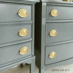 two gray dressers with gold handles and knobs